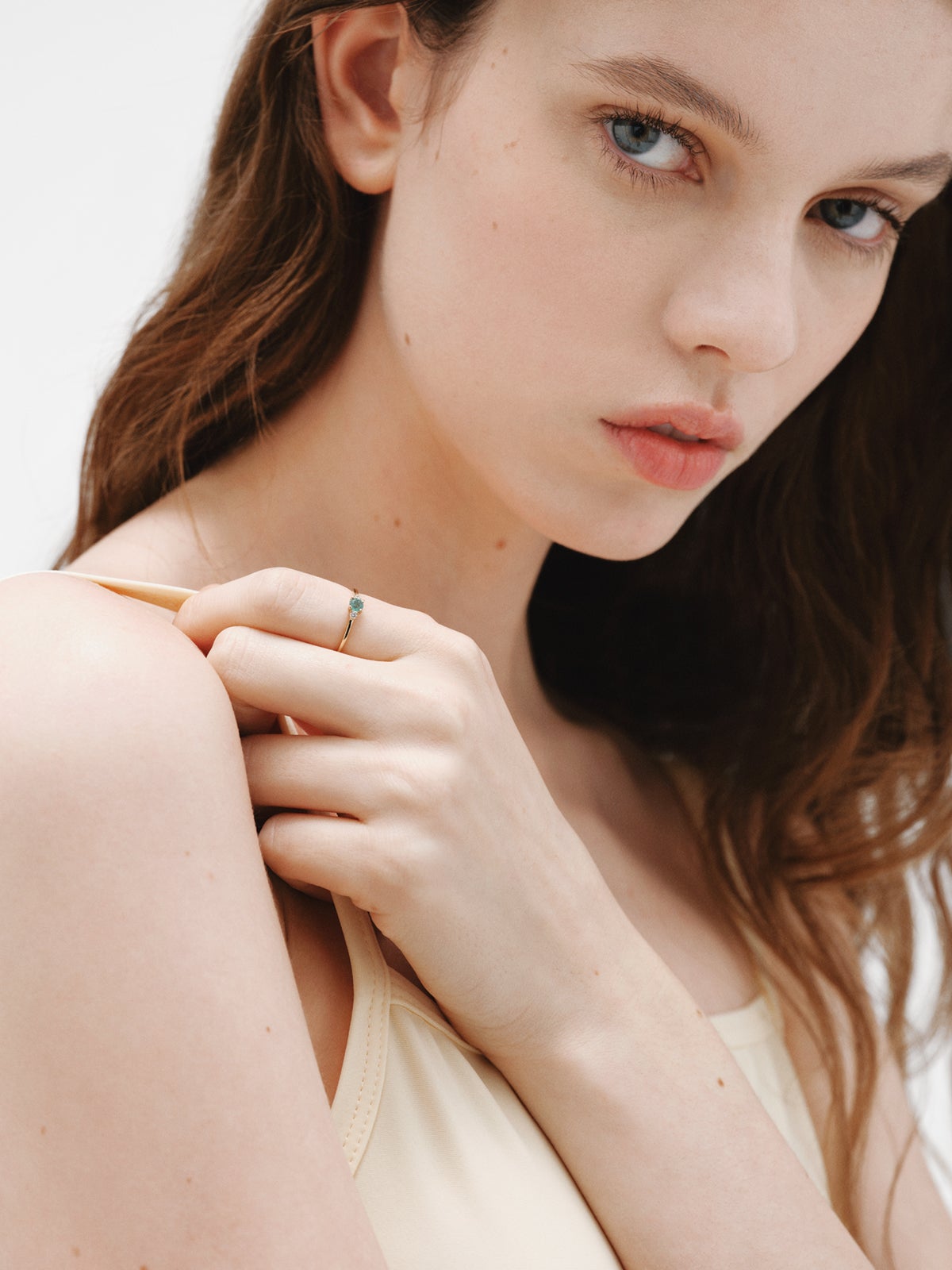 9K Yellow Gold Trilogy Ring with Emerald and Diamonds