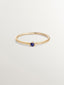 Anillo solitario de oro amarillo de 9K con zafiro azul