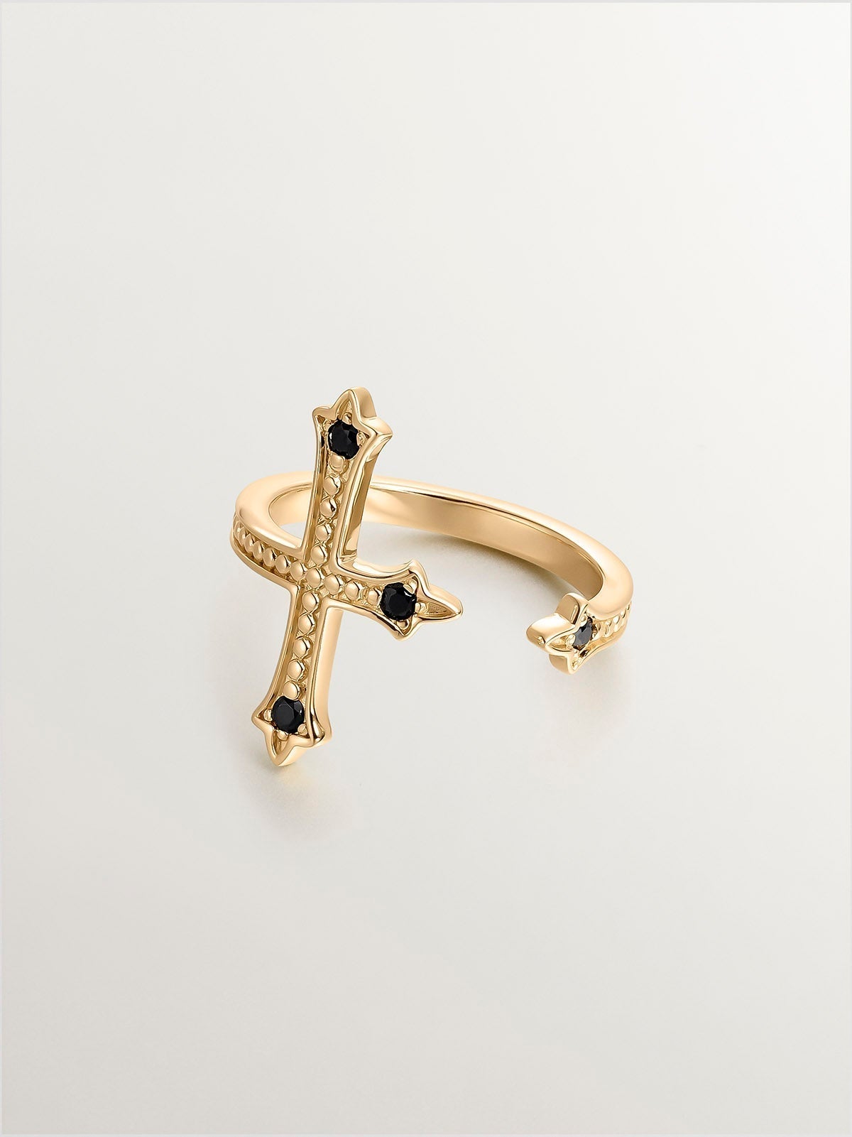 You and Me ring made of 925 silver, bathed in 18K yellow gold, cross-shaped with black spinels.