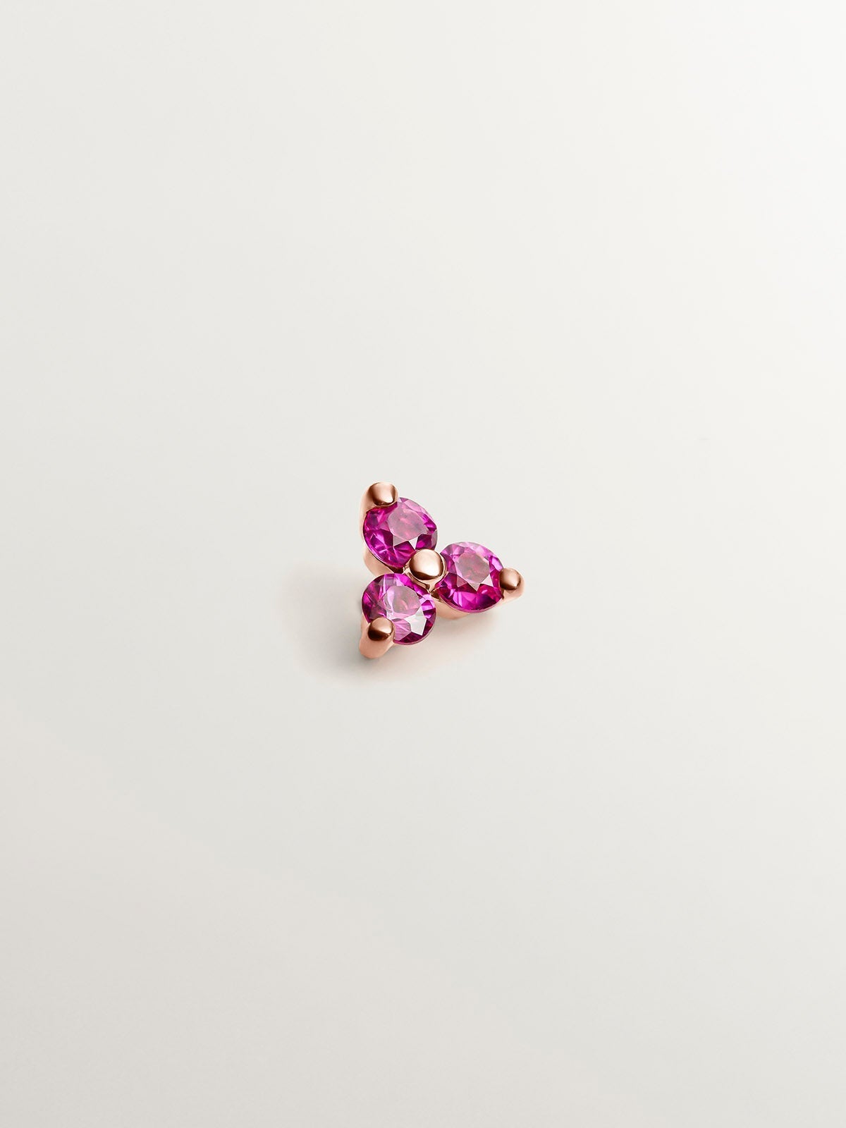 Pendiente individual de oro rosa de 18K con rubíes