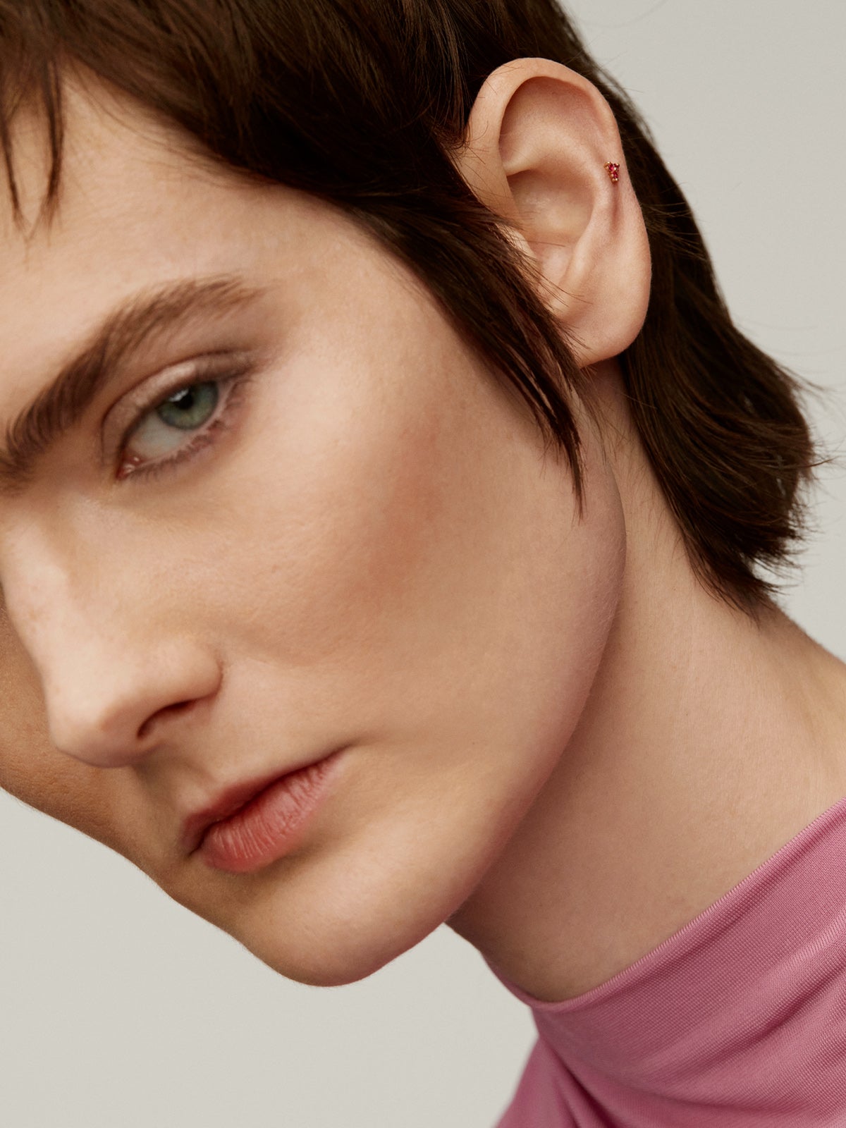 Individual 18K rose gold earring with rubies