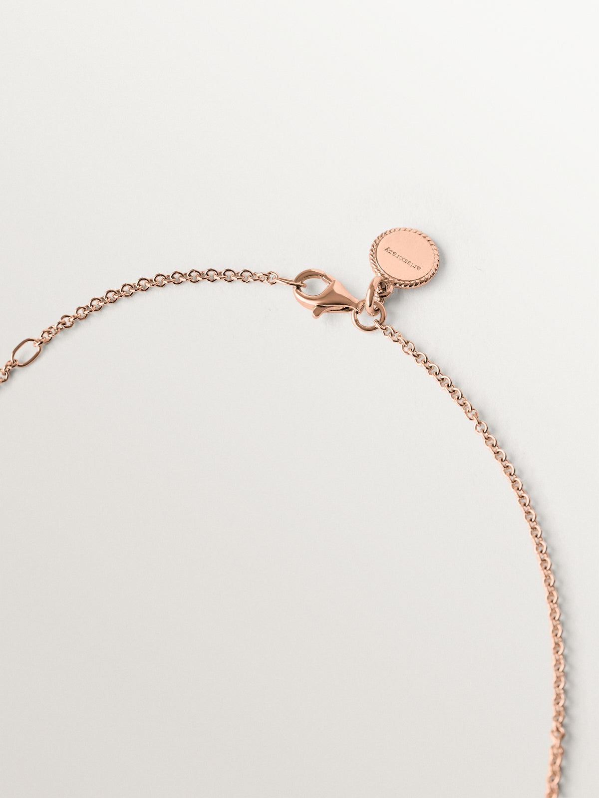Colgante de plata 925 bañada en oro rosa con colmillo de ágata azul