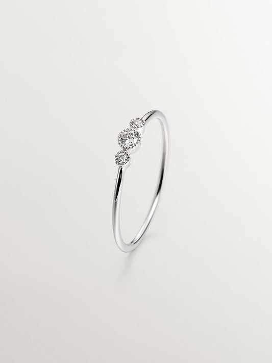 Anillo tresillo de oro blanco de 18K con diamantes 0,0187 cts