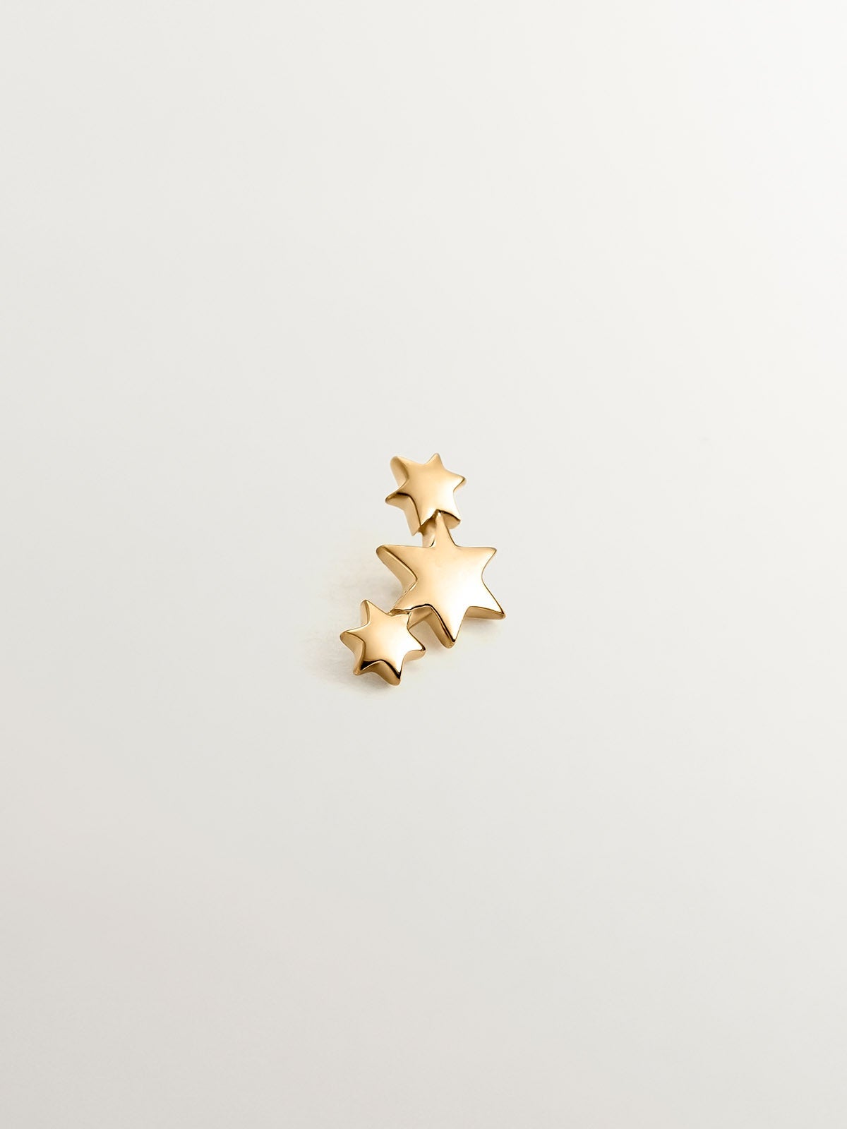 Pendiente individual de oro amarillo de 9K con estrellas