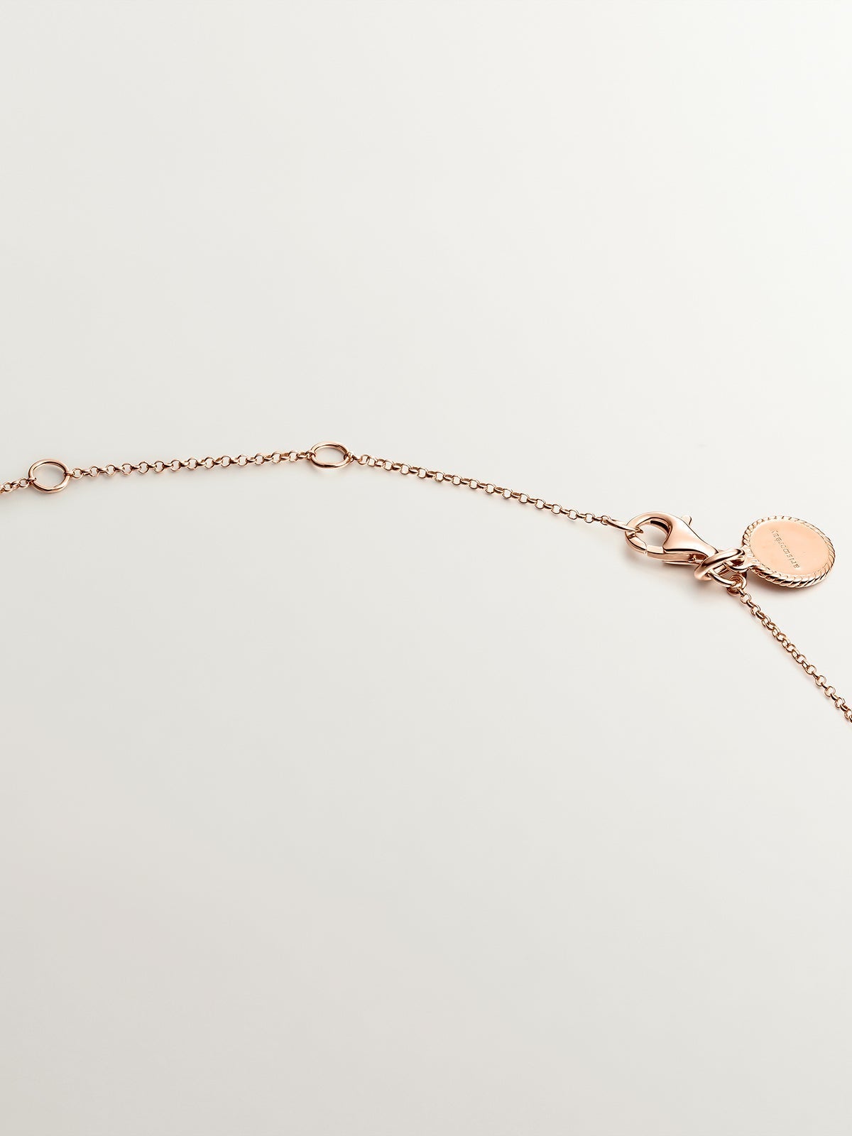 Colgante de plata 925 bañada en oro rosa de 18K con topacios azul london y blancos