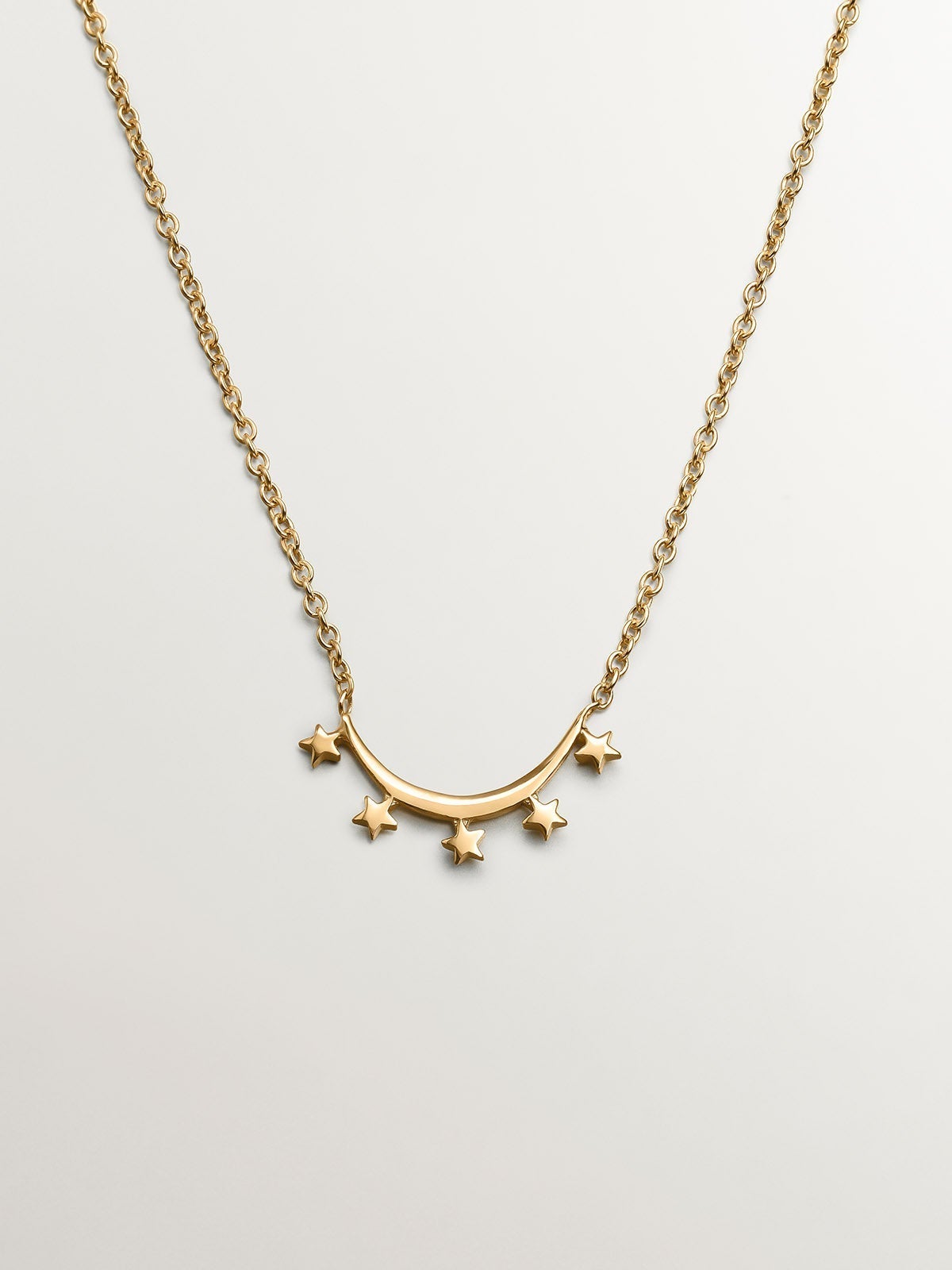 Colgante de plata 925 bañada en oro amarillo de 18K con arco de estrellas