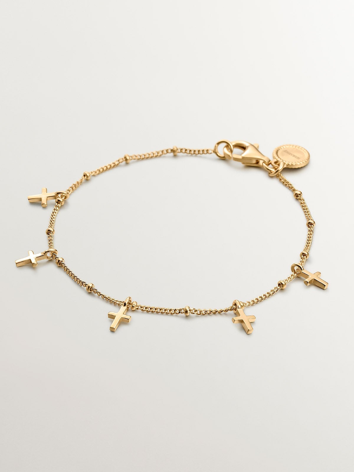 Pulsera de plata 925 bañada en oro amarillo de 18K con cruces