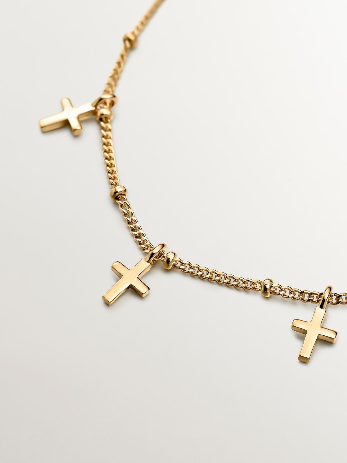 Pulsera de plata 925 bañada en oro amarillo de 18K con cruces