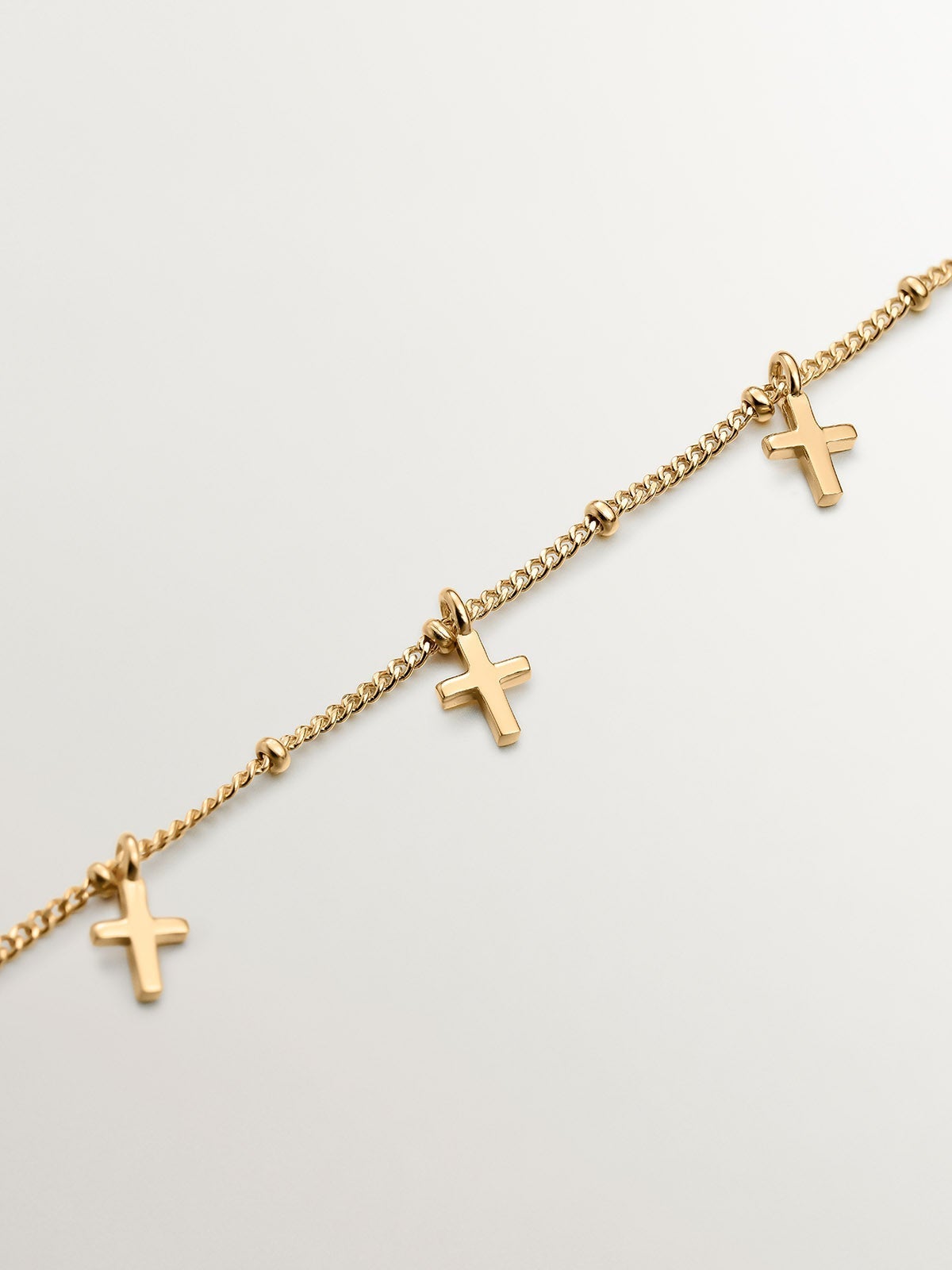 Pulsera de plata 925 bañada en oro amarillo de 18K con cruces