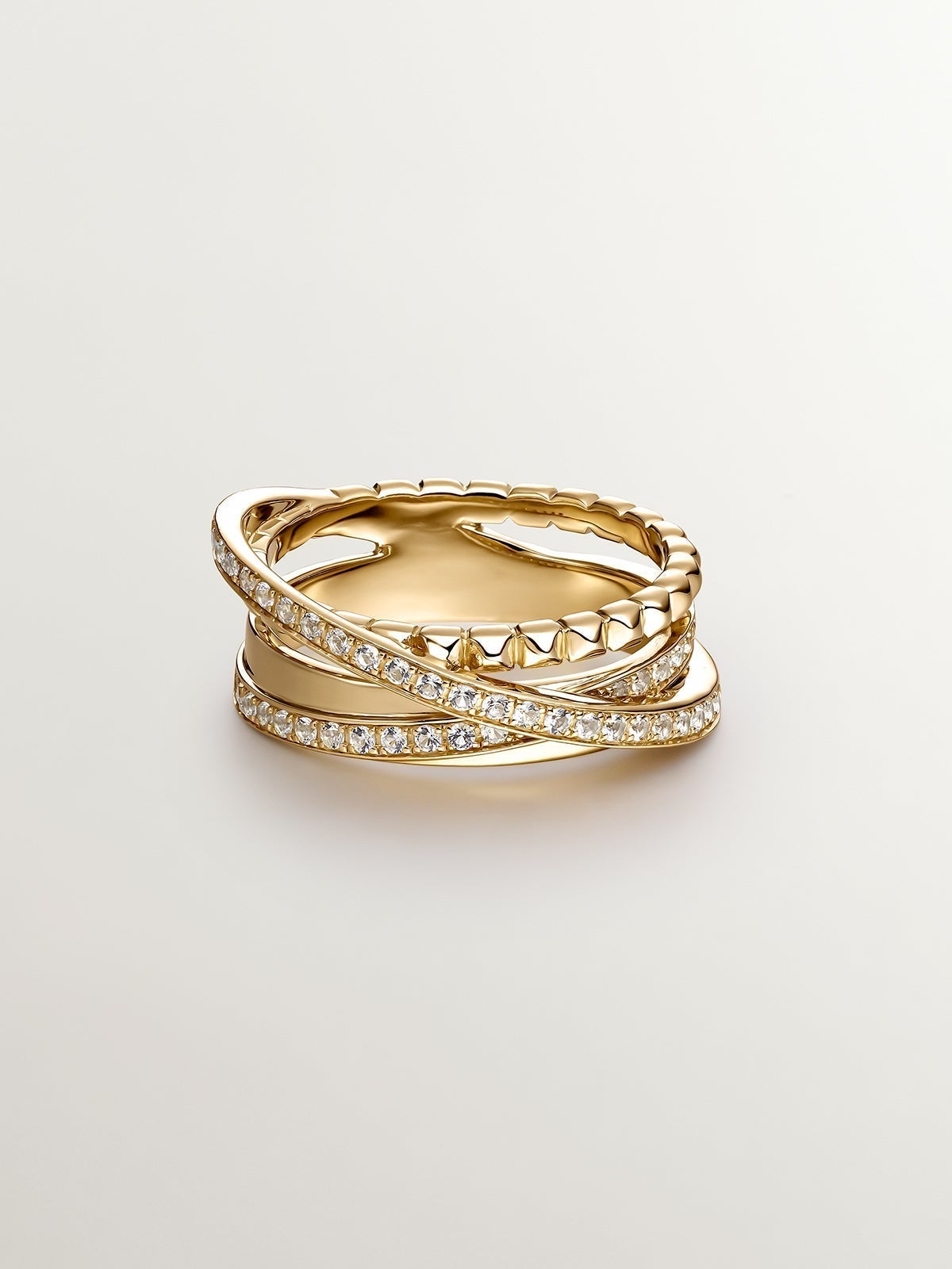 Anillo multibrazo cruzado de plata 925 bañada en oro amarillo de 18K con topacios