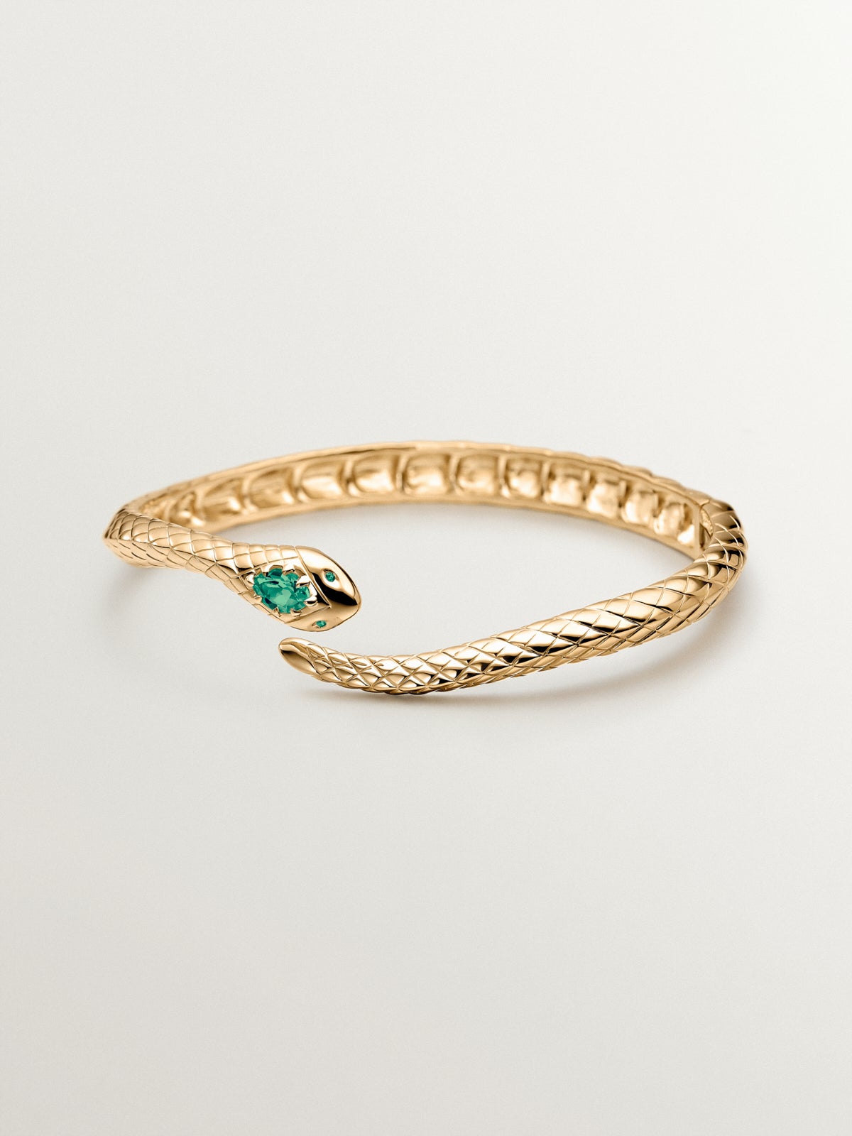 Pulsera rígida de plata 925 bañada en oro amarillo de 18K con ónix verde y con forma de serpiente