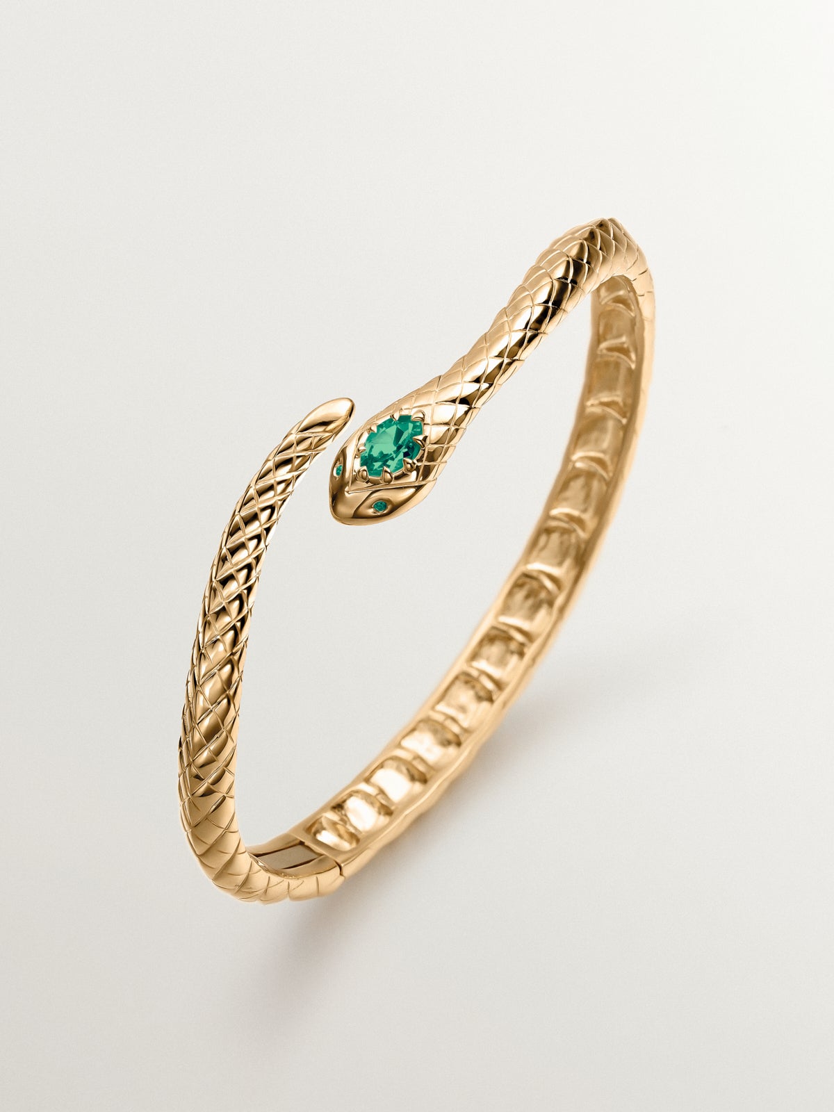 Pulsera rígida de plata 925 bañada en oro amarillo de 18K con ónix verde y con forma de serpiente