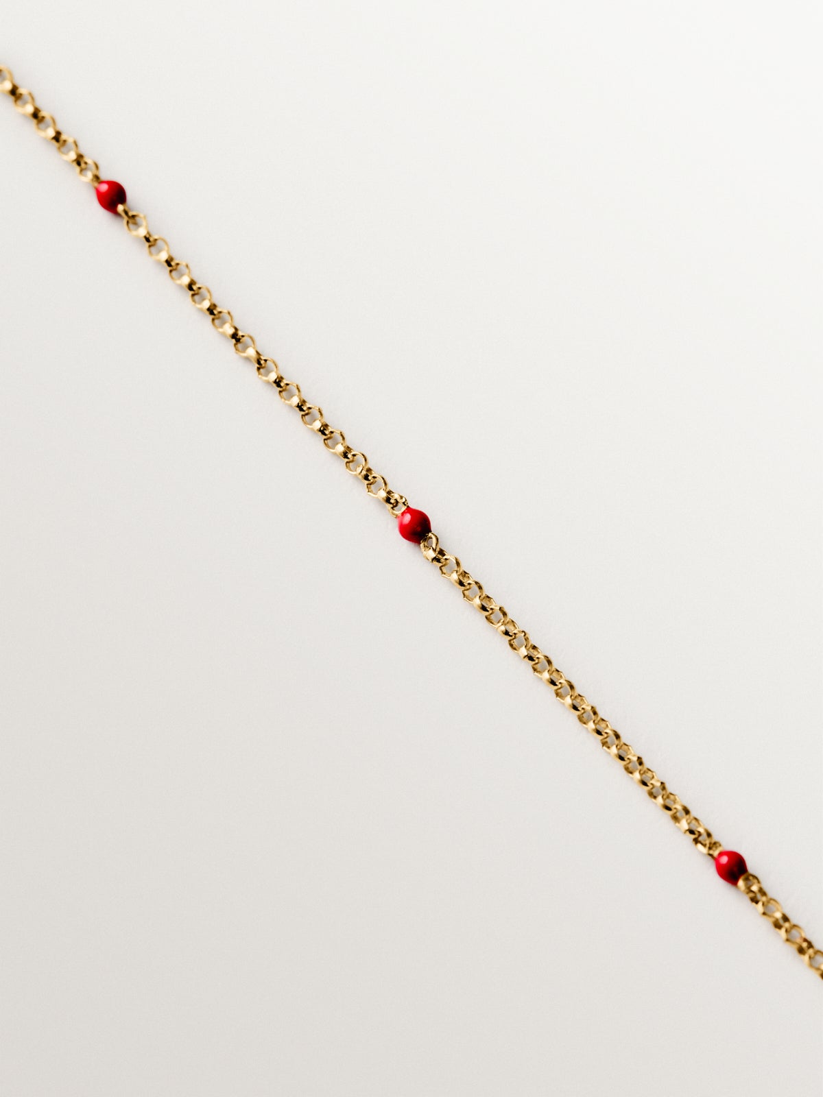 Pulsera de oro amarillo de 9K con esmalte rosa