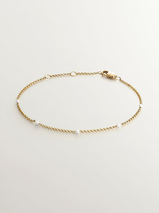 Pulsera de eslabones de oro amarillo de 9K con bolitas de esmalte blanco