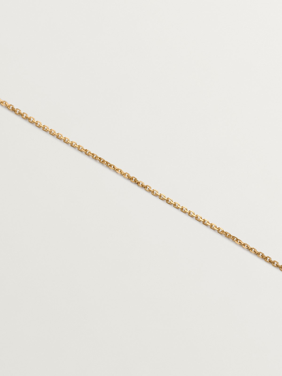 Colgante de oro amarillo de 18K con corazones entrelazados