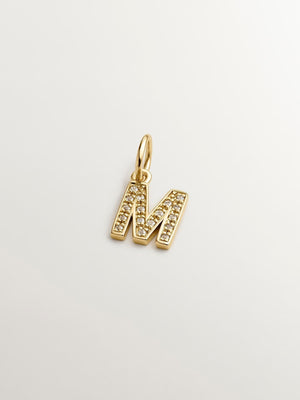 Charm de plata 925 bañada en oro amarillo de 18K y topacios blancos inicial M