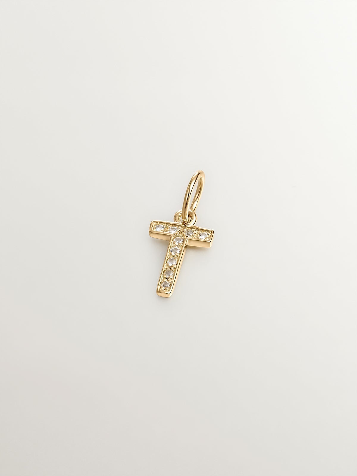 Charm de plata 925 bañada en oro amarillo de 18K y topacios blancos inicial T