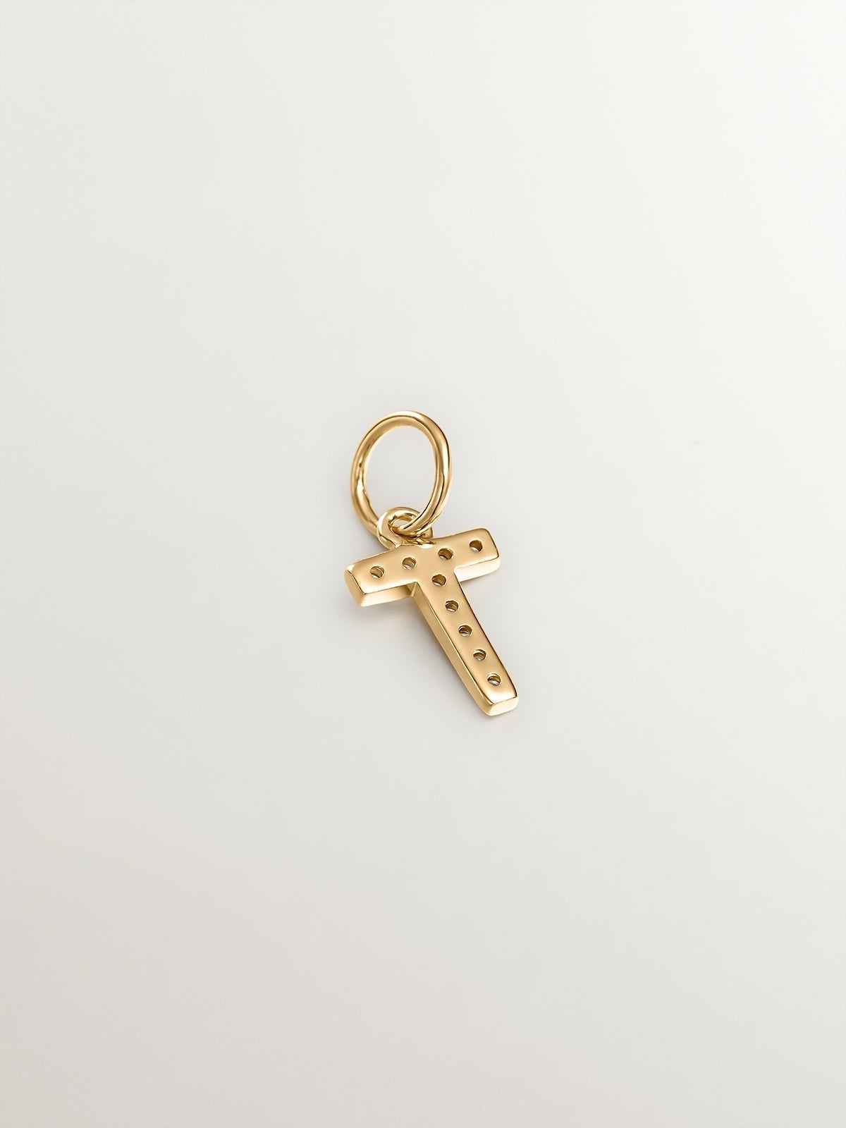 Charm de plata 925 bañada en oro amarillo de 18K y topacios blancos inicial T