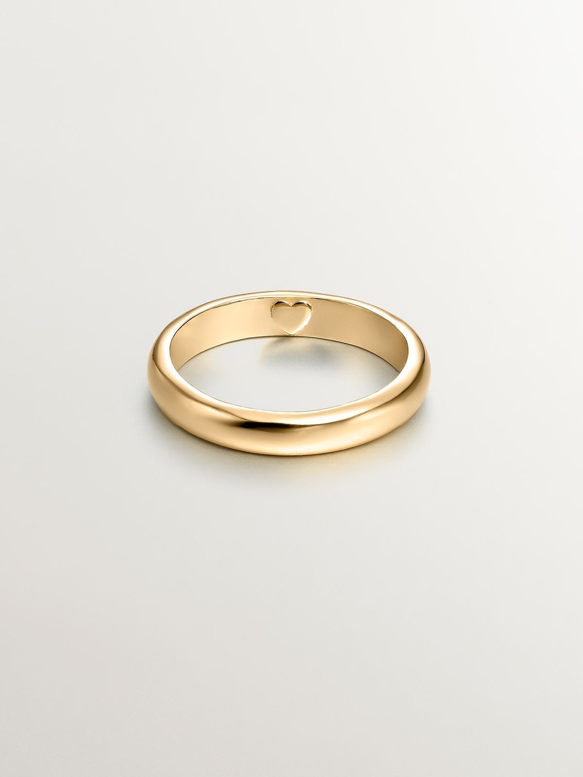 925 Silver band-style ring bathed in 18K yellow gold with an internal heart.