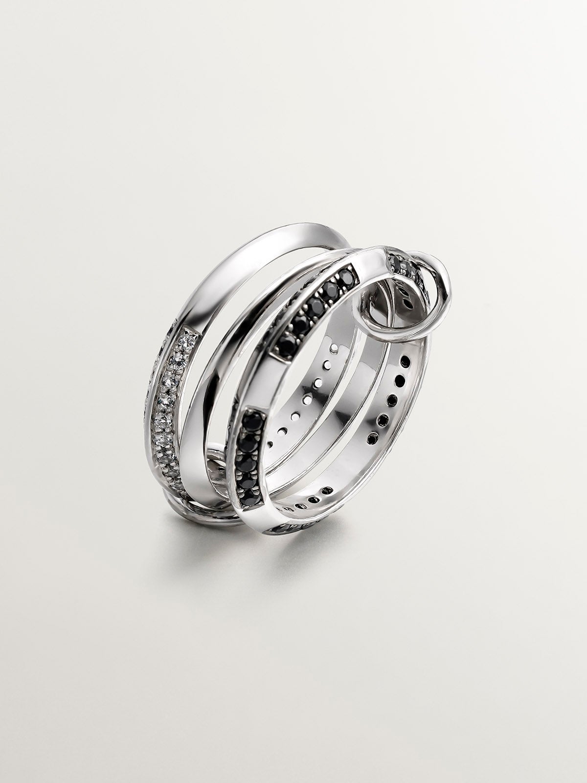 Anillo triple de plata 925 con topacios blancos y espinelas negras