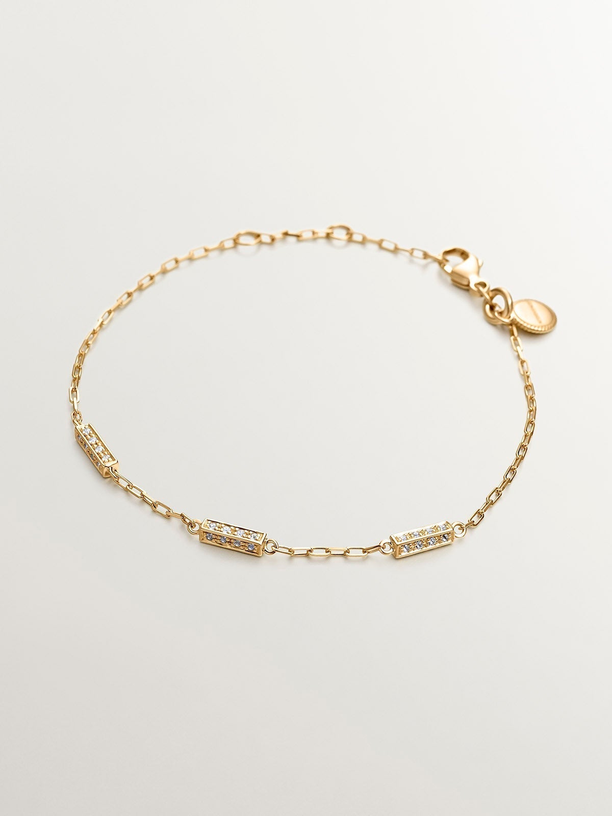 Pulsera eslabones rolo de plata 925 bañada en oro amarillo de 18K con topacios blancos