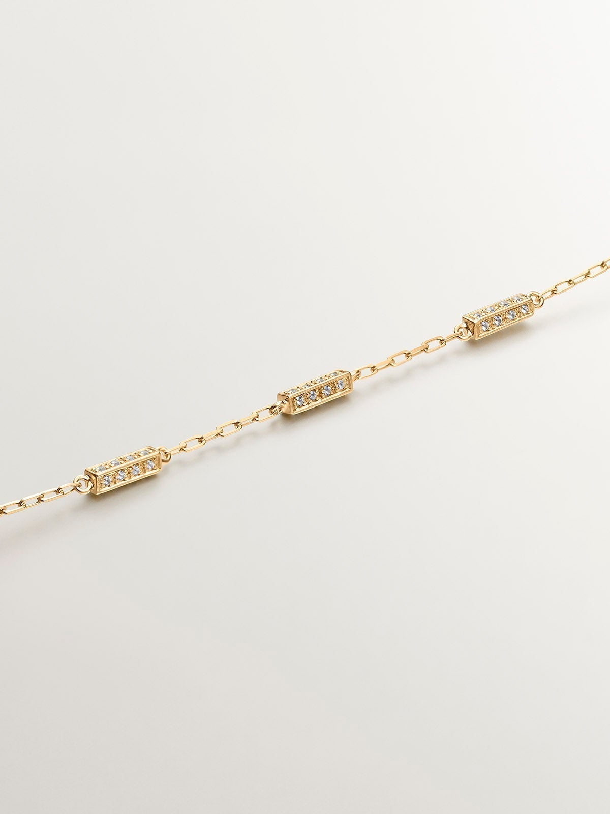 Pulsera eslabones rolo de plata 925 bañada en oro amarillo de 18K con topacios blancos