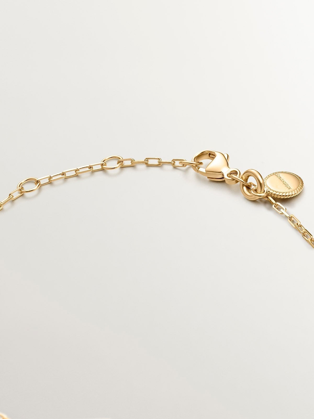 Pulsera eslabones rolo de plata 925 bañada en oro amarillo de 18K con topacios blancos