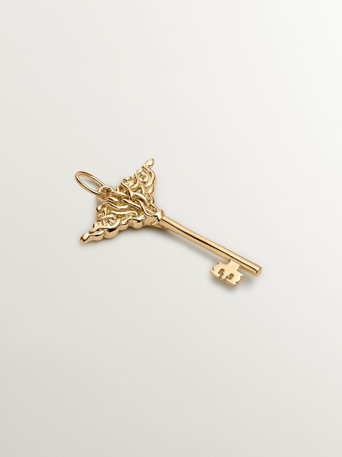 Charm de plata 925 bañada en oro amarillo de 18K con forma de llave