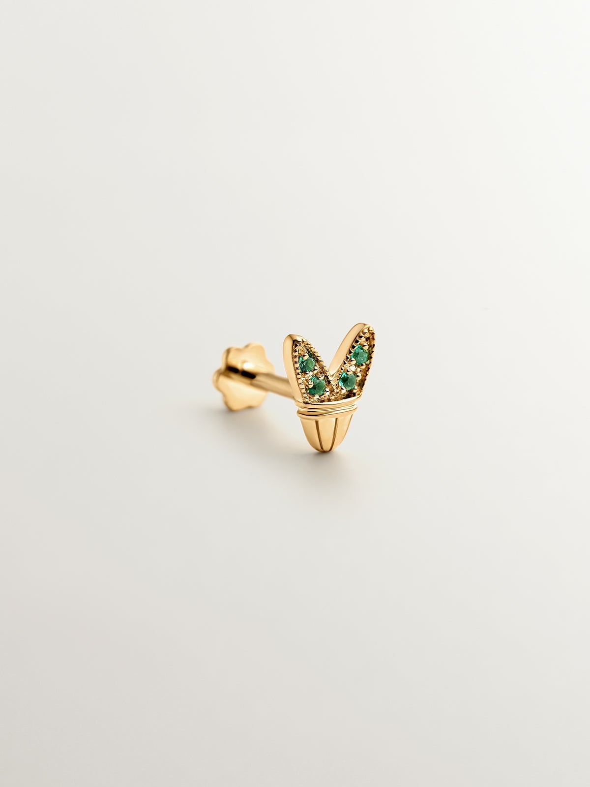 Piercing de oro amarillo de 18K con esmeraldas y forma de alas