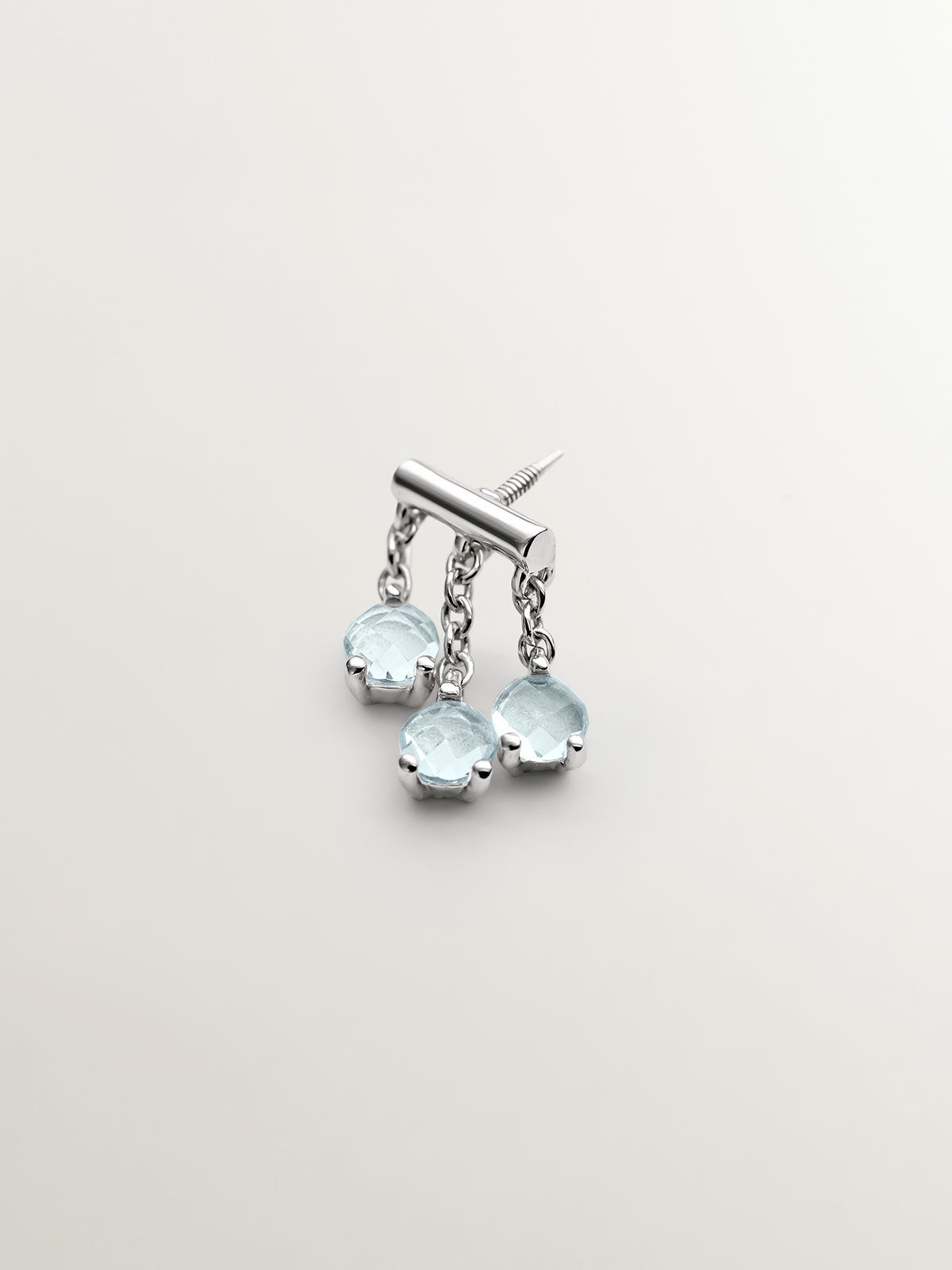 Pendiente individual de oro blanco de 18K con topacios azul sky