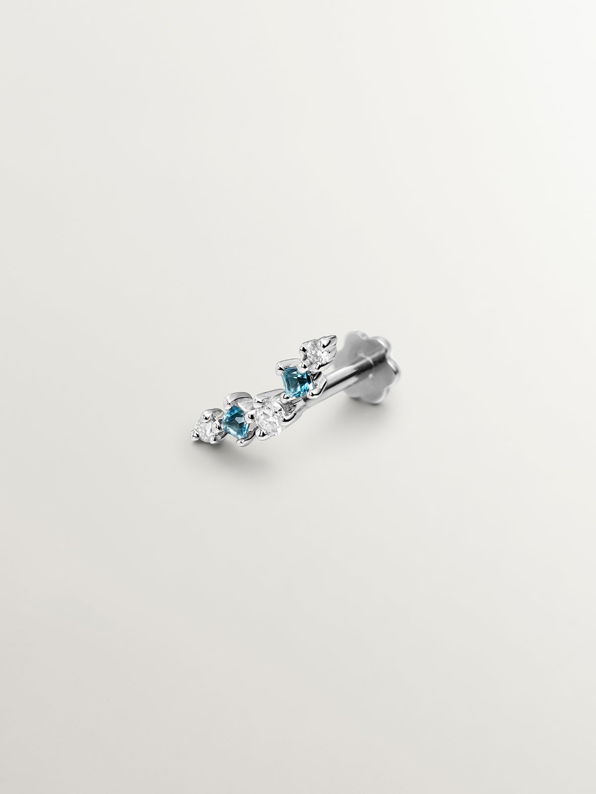 Pendiente individual de oro de 18K con topacio azul