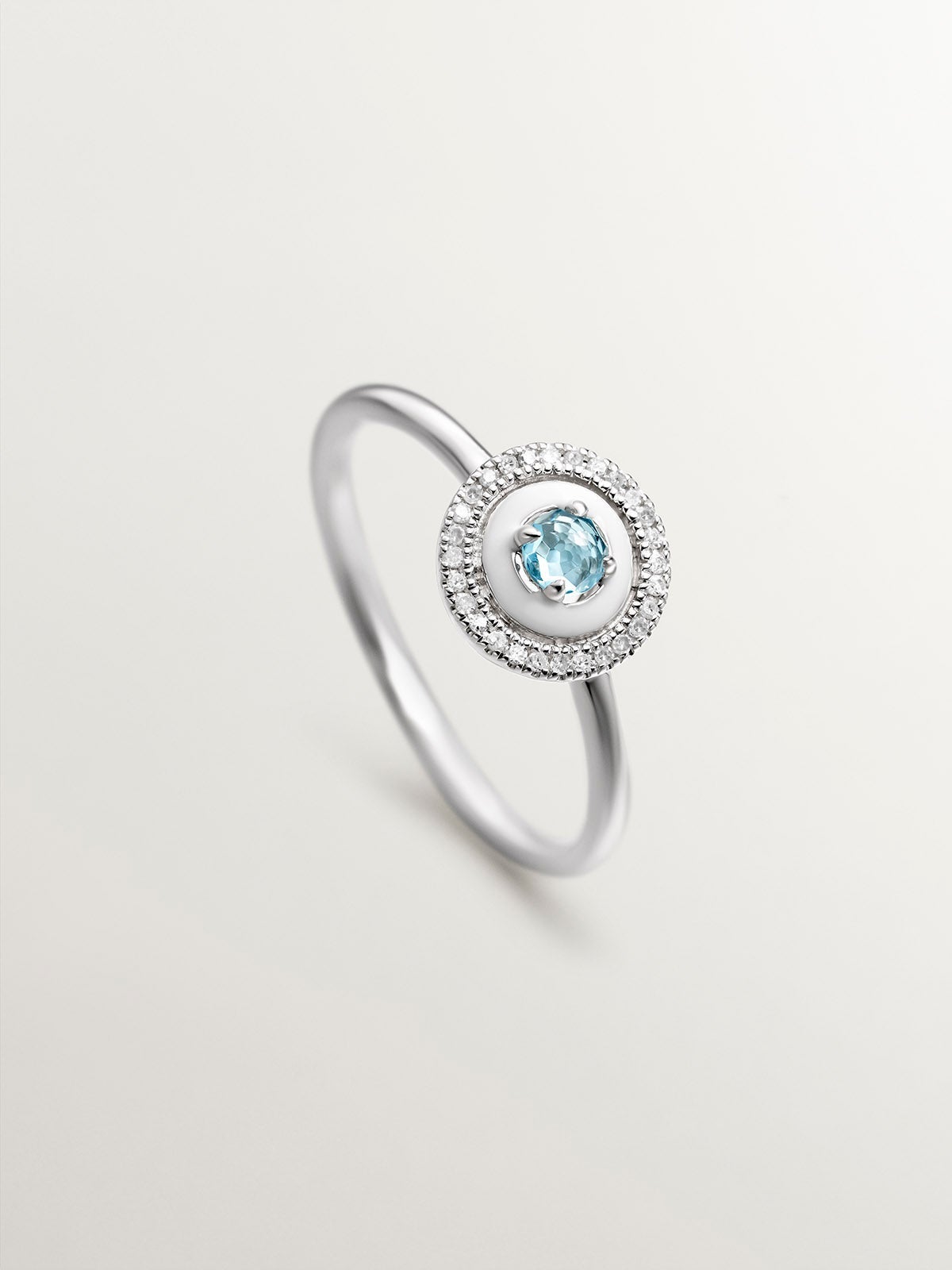 Anillo de plata 925 con topacio azul swiss, diamantes blancos y esmalte blanco