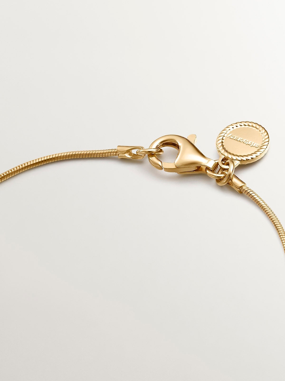 Pulsera de plata 925 bañada en oro amarillo de 18K de eslabones barbado con motivo geométrico