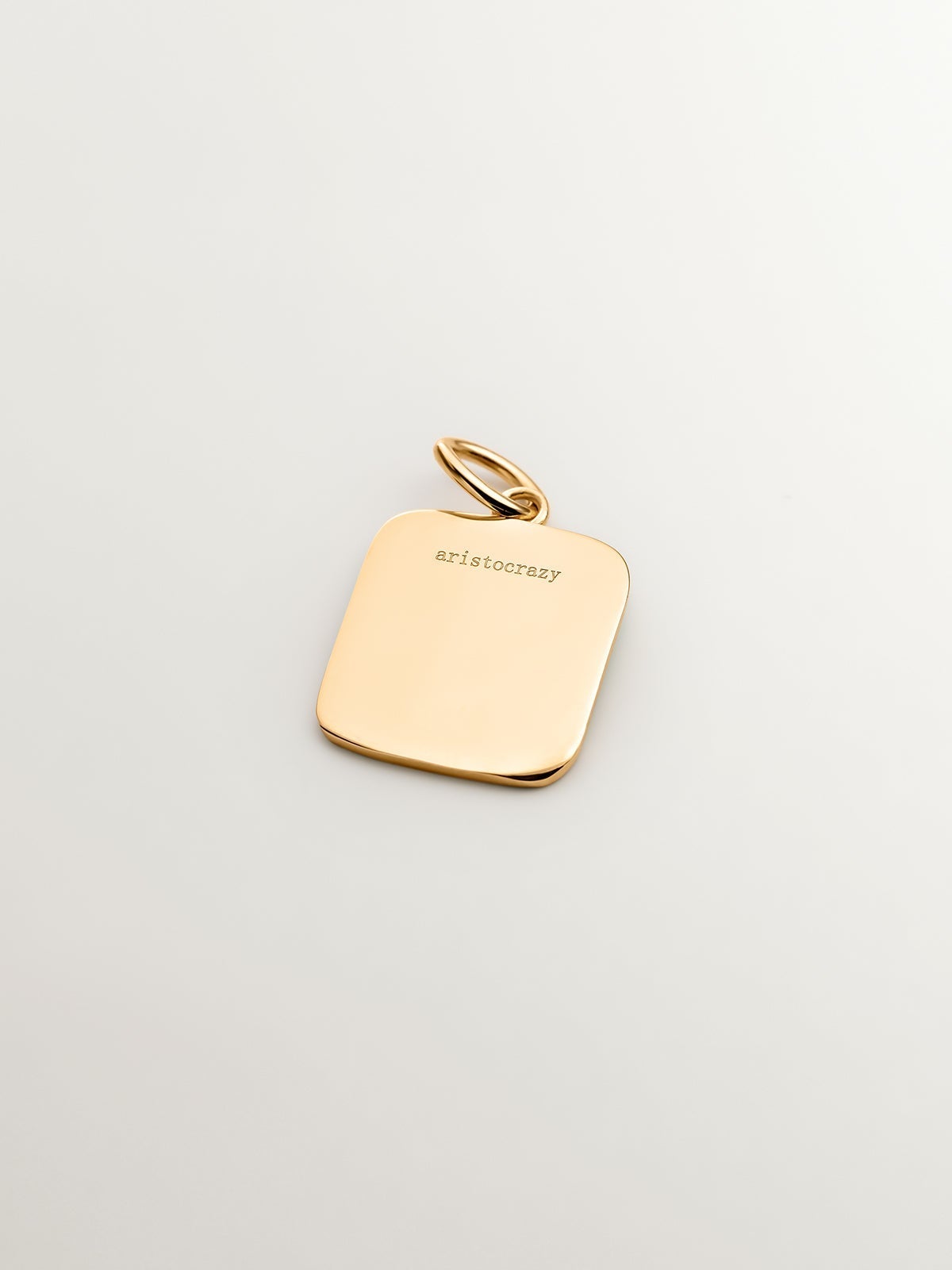 Charm de plata 925 bañada en oro amarillo de 18K con inicial H y esmalte turquesa con forma cuadrada