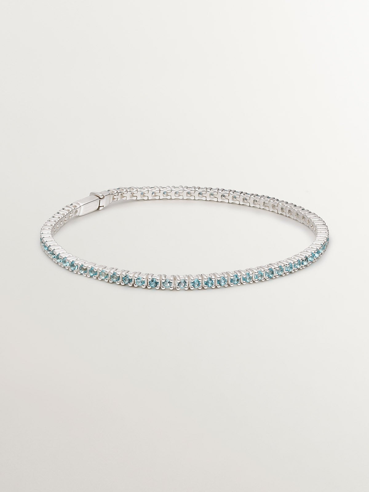 Pulsera de plata 925 bañada en oro amarillo de 18K con topacios azul swiss