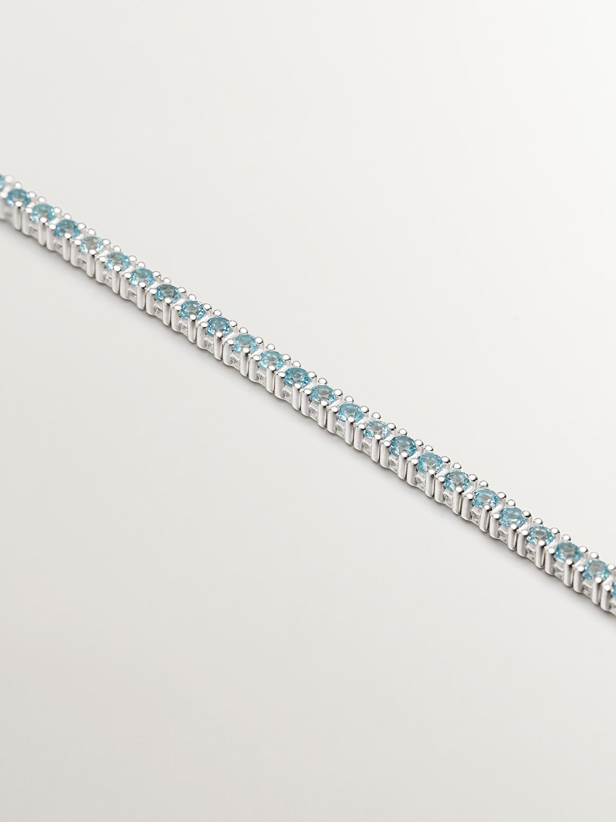 Pulsera de plata 925 bañada en oro amarillo de 18K con topacios azul swiss