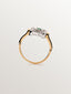 Anillo de oro blanco y oro amarillo de 18K con diamantes en talla brillante y esmeraldas en talla brillante