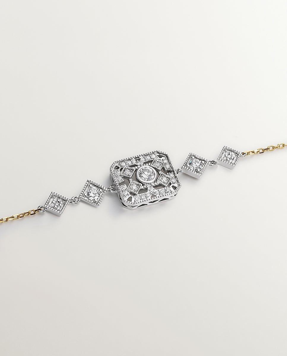 Pulsera de oro blanco y amarillo de 18K con diamantes en talla brillante
