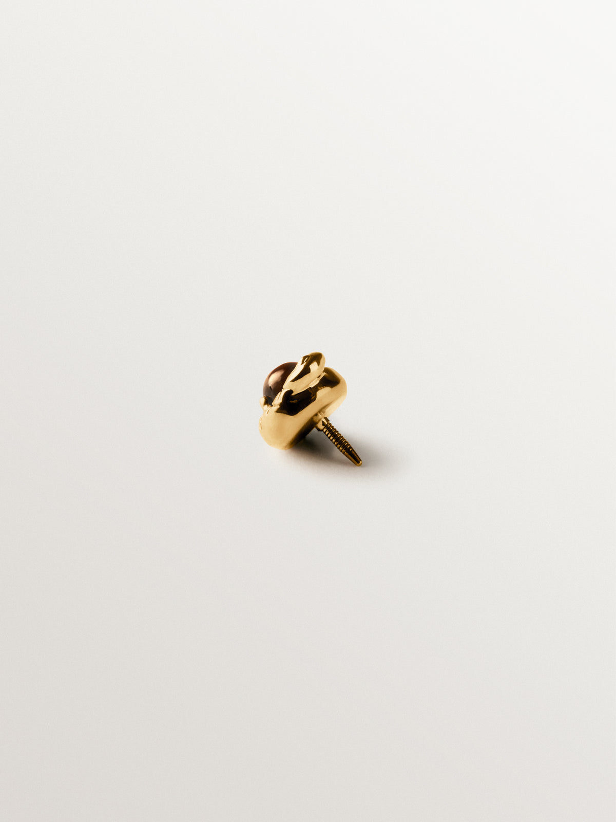Piercing de oro amarillo de 18K con forma de serpiente y ojo de tigre