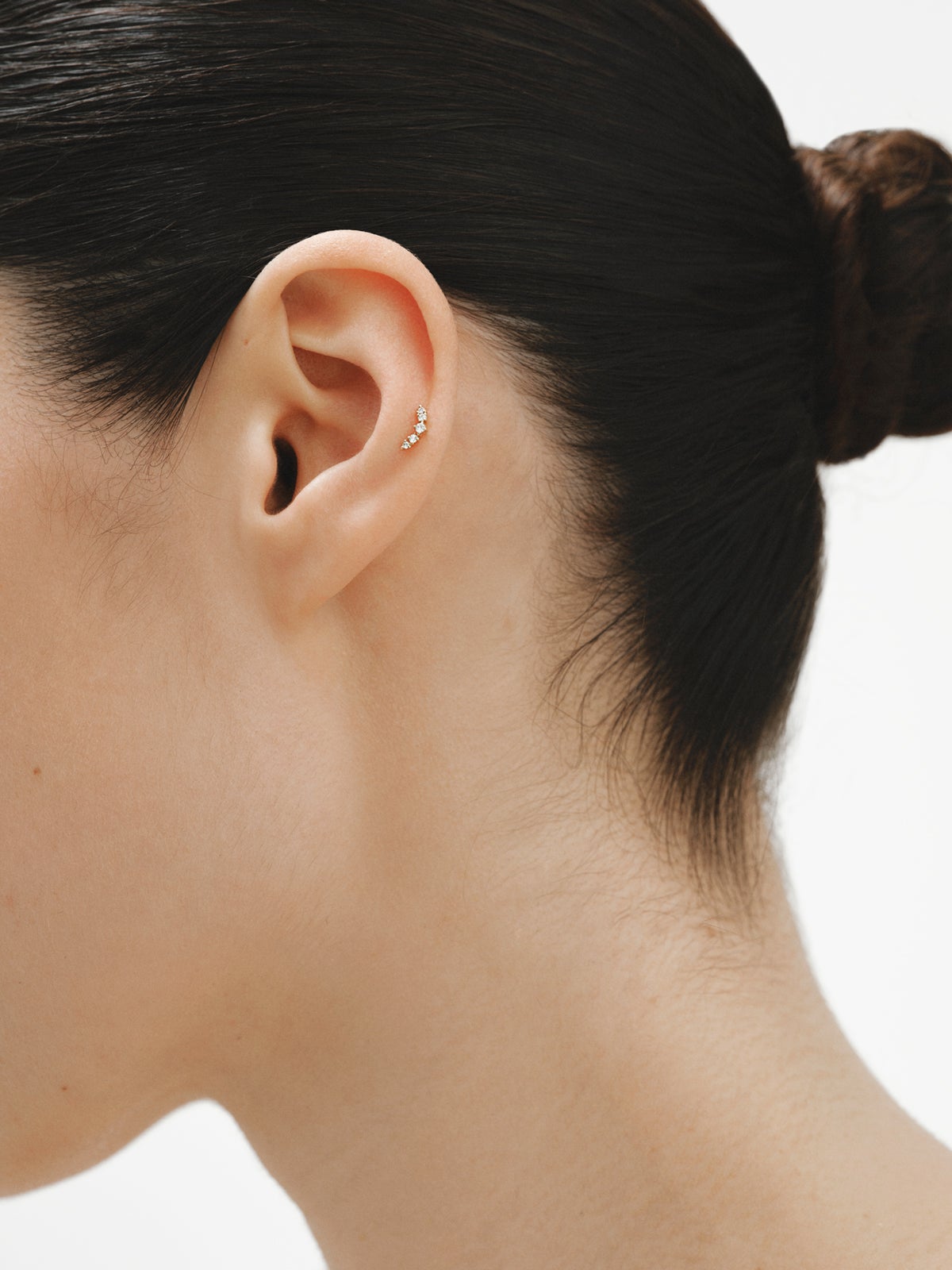 Piercing trepador de oro amarillo de 18K con diamantes