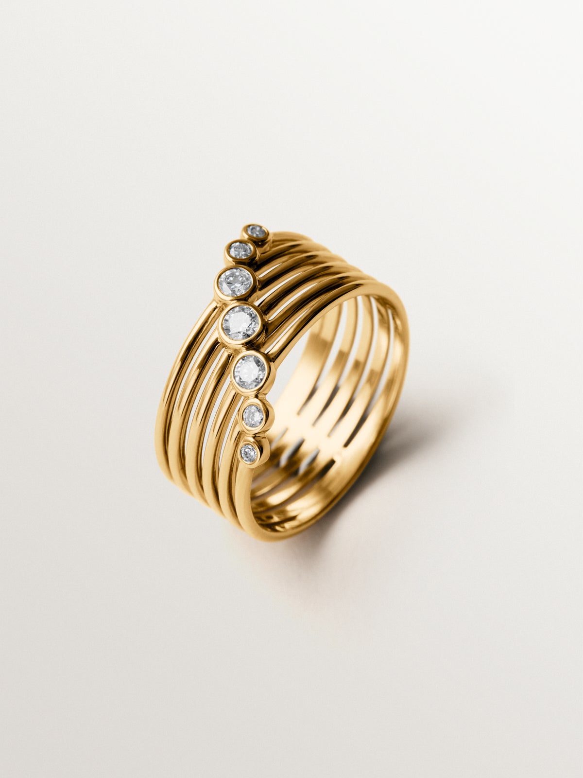 Anillo multibrazo de oro blanco y amarillo de 9K con diamantes en talla brillante