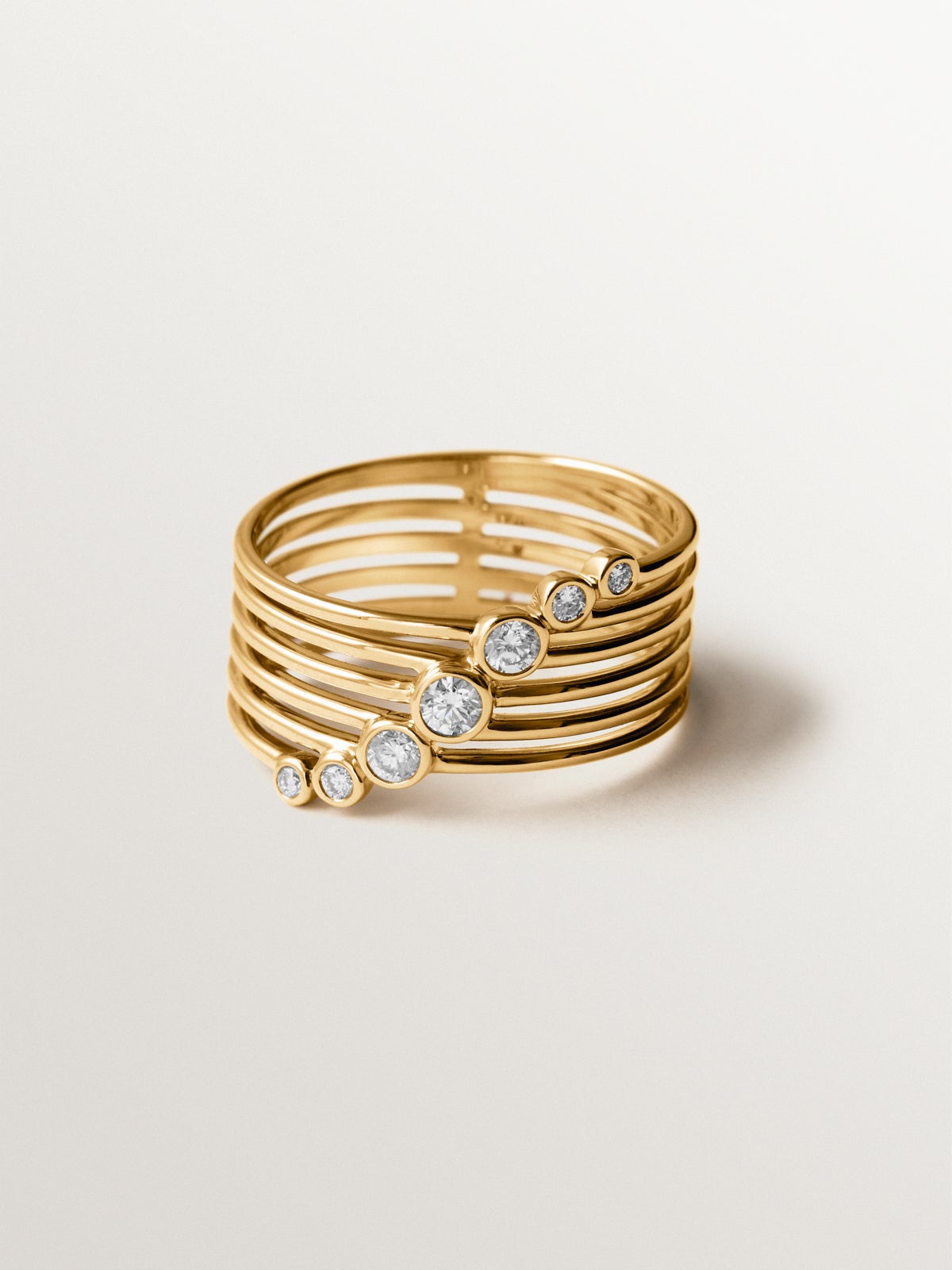 Anillo multibrazo de oro blanco y amarillo de 9K con diamantes en talla brillante