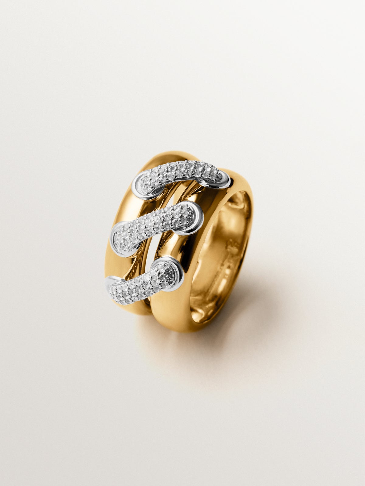Anillo doble de plata 925 bañada en rodio y oro amarillo de 18K con pavé de topacios blancos