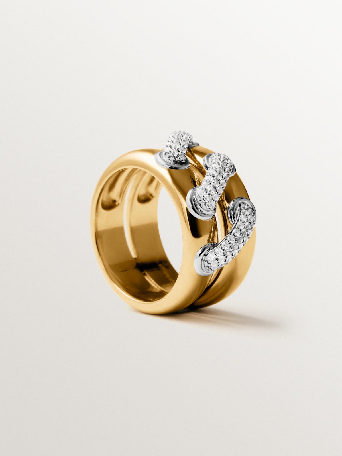 Anillo doble de plata 925 bañada en rodio y oro amarillo de 18K con pavé de topacios blancos