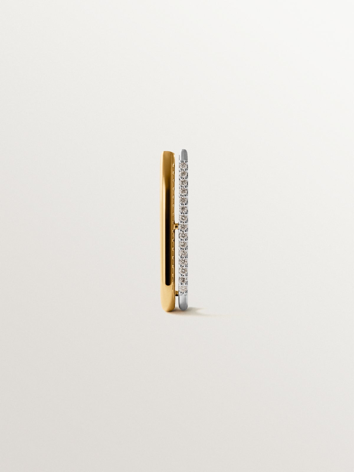 Pendiente individual de oro blanco y amarillo de 18K con diamantes