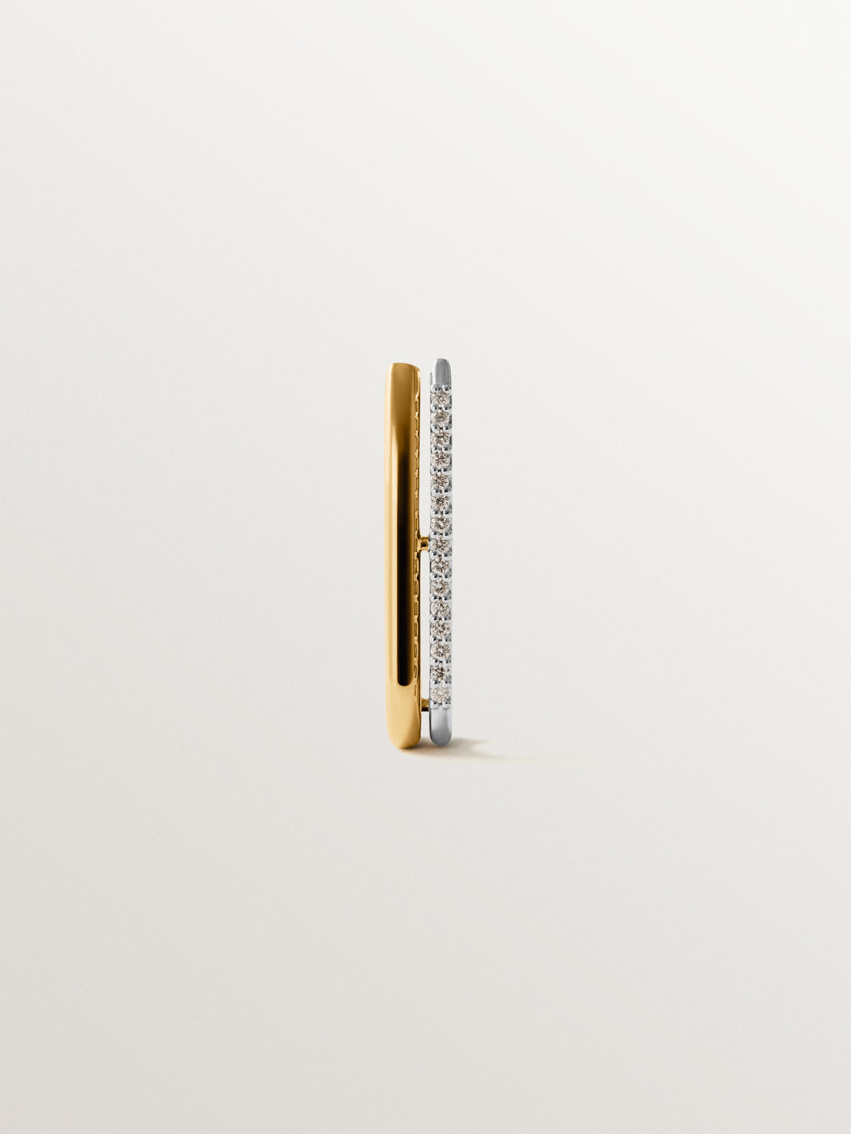 Pendiente individual de oro blanco y amarillo de 18K con diamantes