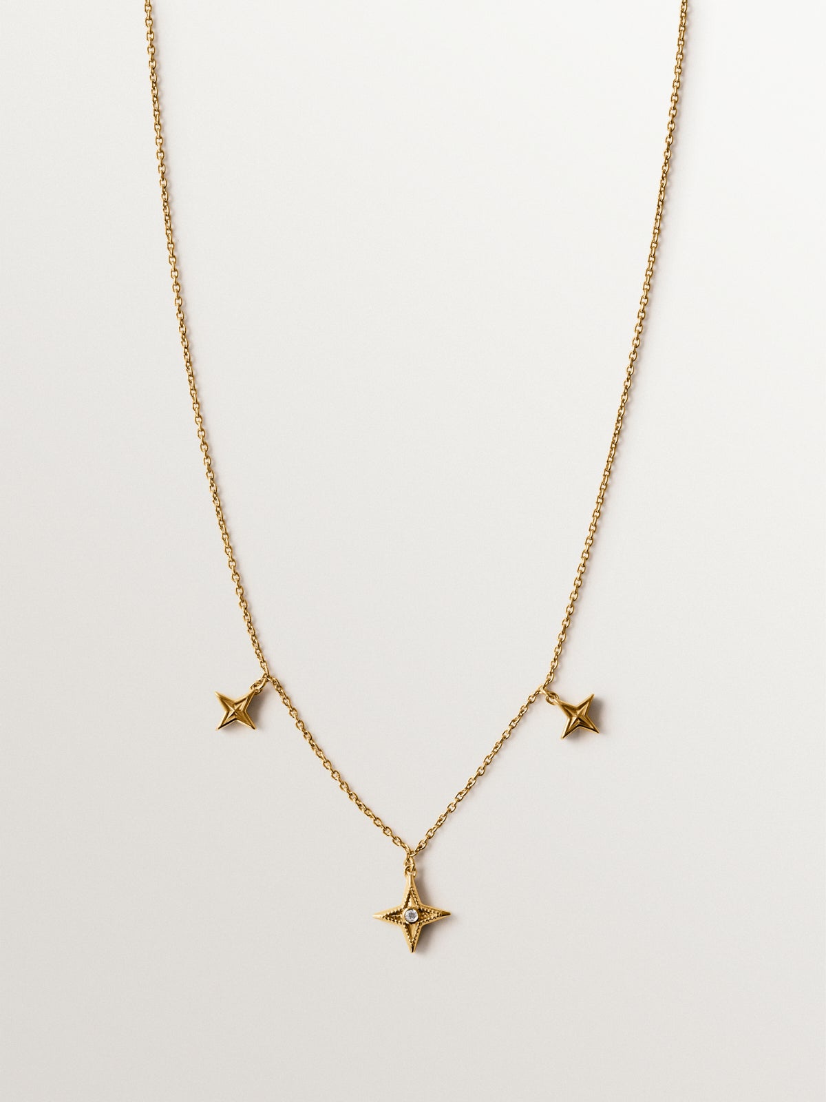 Collar de plata 925 bañada en oro amarillo de 18K con topacio blanco y estrellas