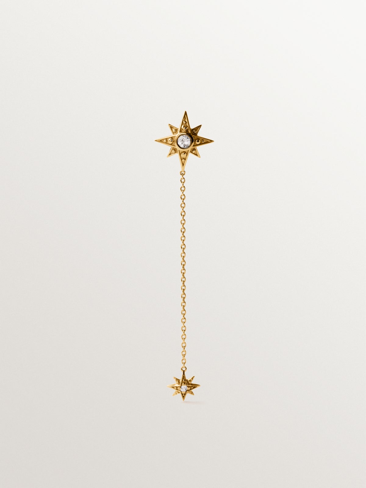 Pendiente individual largo de plata 925 bañada en oro amarillo de 18K con topacios blancos