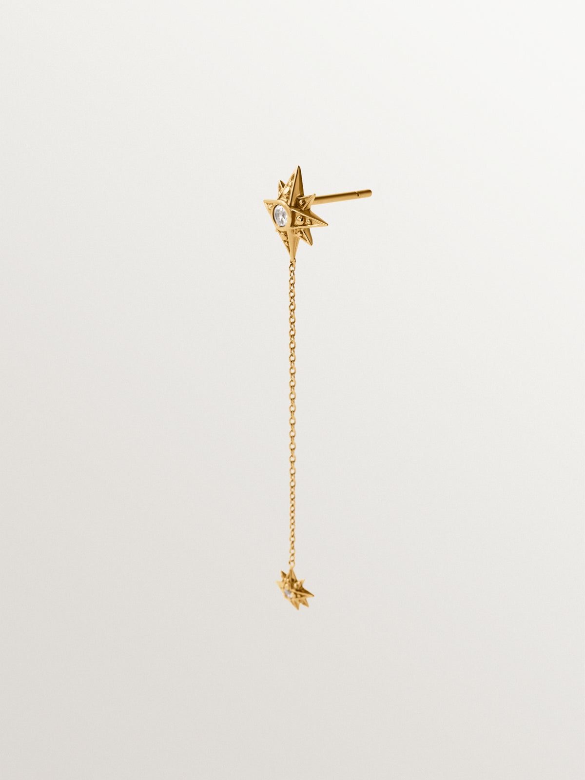 Pendiente individual largo de plata 925 bañada en oro amarillo de 18K con topacios blancos