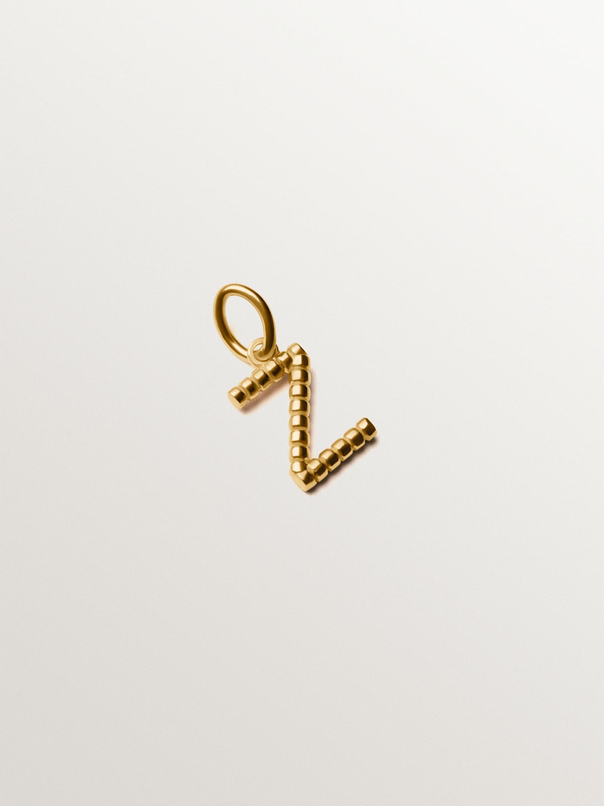 Charm de plata 925 bañada en oro amarillo de 18K con letra Z y motivos de esferas